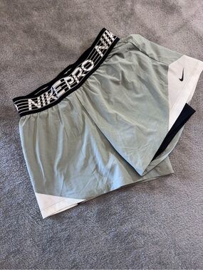 Nike Women’s gray Athletic Shorts with Black Logo Waistband